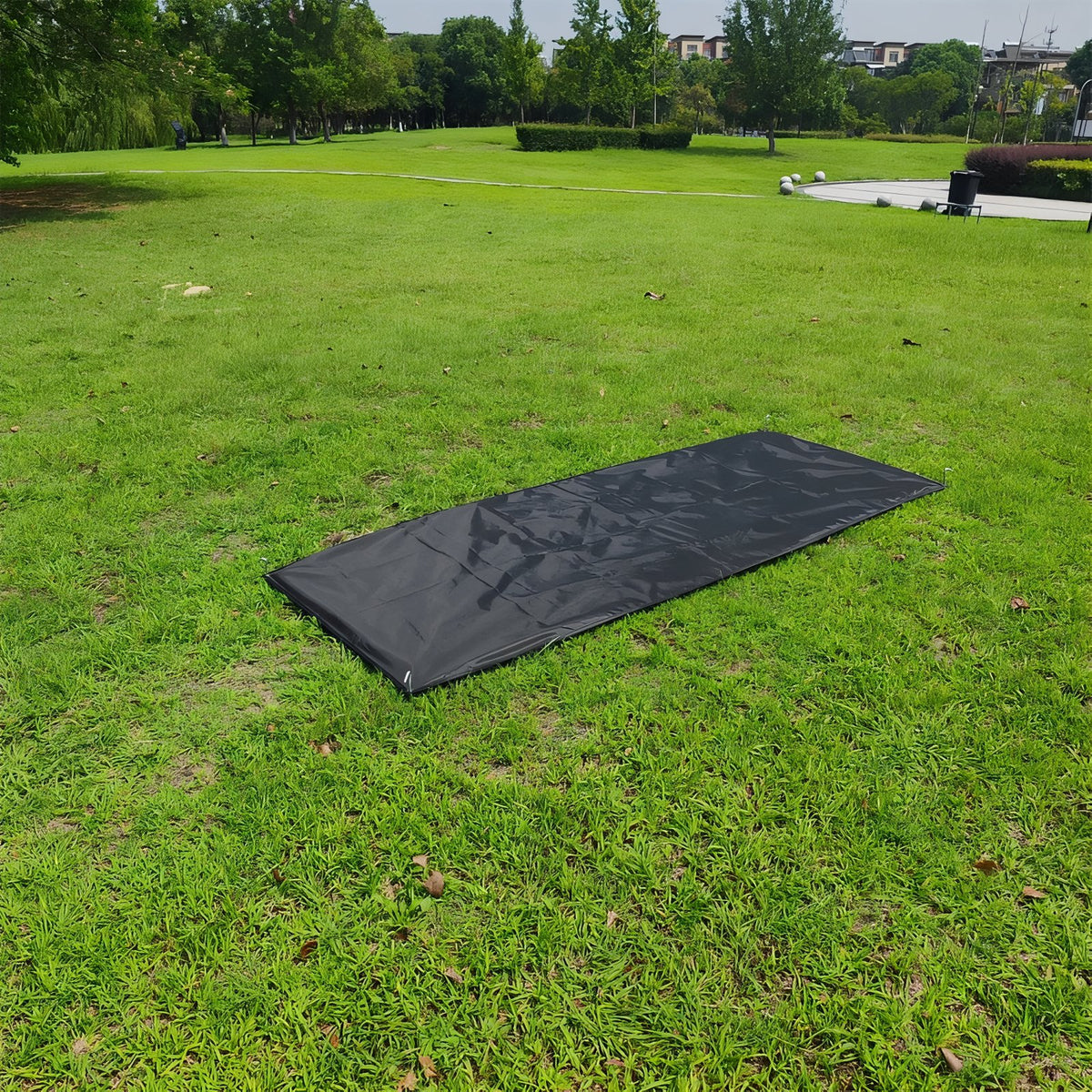 Lightweight 1-Person Bivouac Tent in situ on grass - Olive Green - Sand Beige - Groundsheet